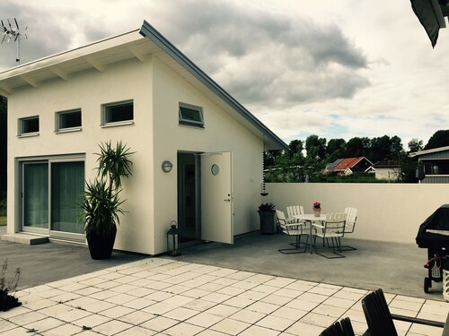Cozy little house with a patio near the center!