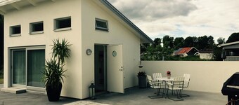 Cozy little house with a patio near the center!
