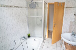 Shower, hair dryer, towels, soap