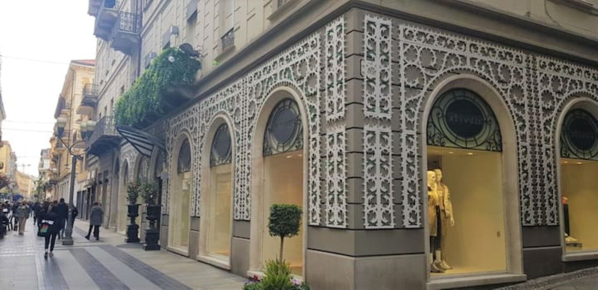 A building with ornate architectural details, including decorative patterns and arched windows.