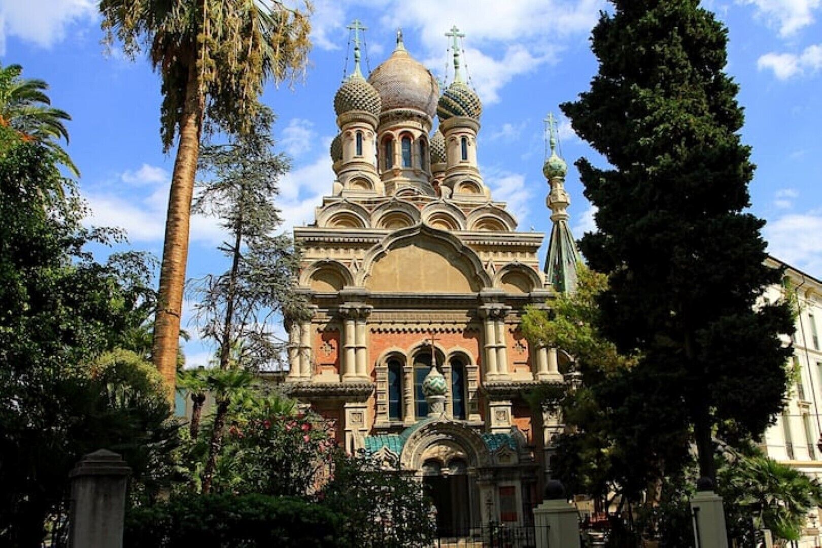 A historic church with multiple domes and a central entrance.