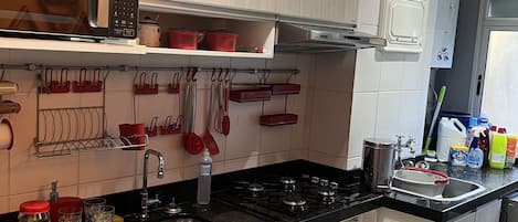 Fridge, microwave, stovetop, coffee/tea maker