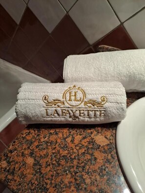 Rainfall showerhead, hair dryer, slippers, towels