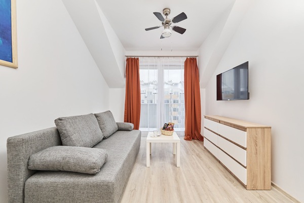 Living room with a comfortable sofa and TV.