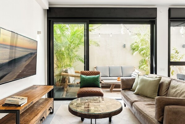 Appartement Exclusif | Coin séjour | Télévision à écran plat