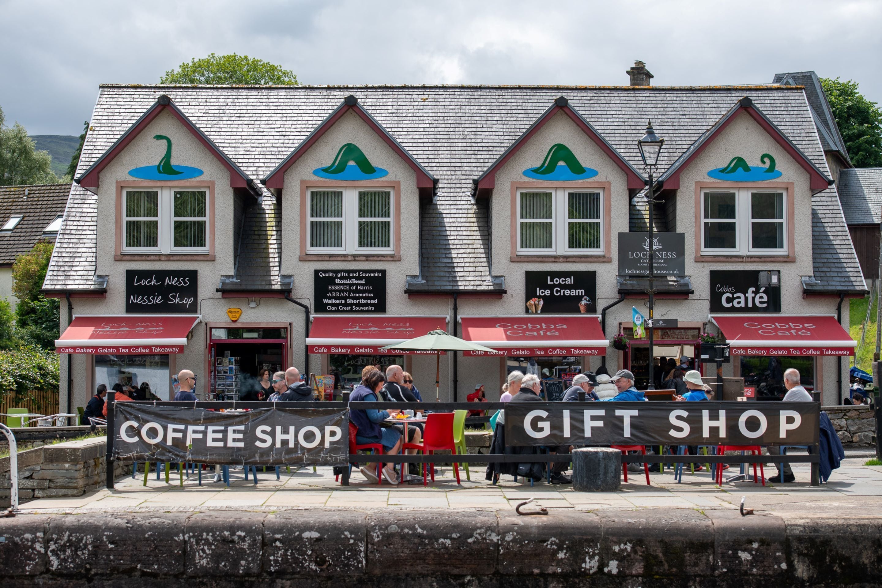 A building with multiple shops including a coffee shop and a gift shop.