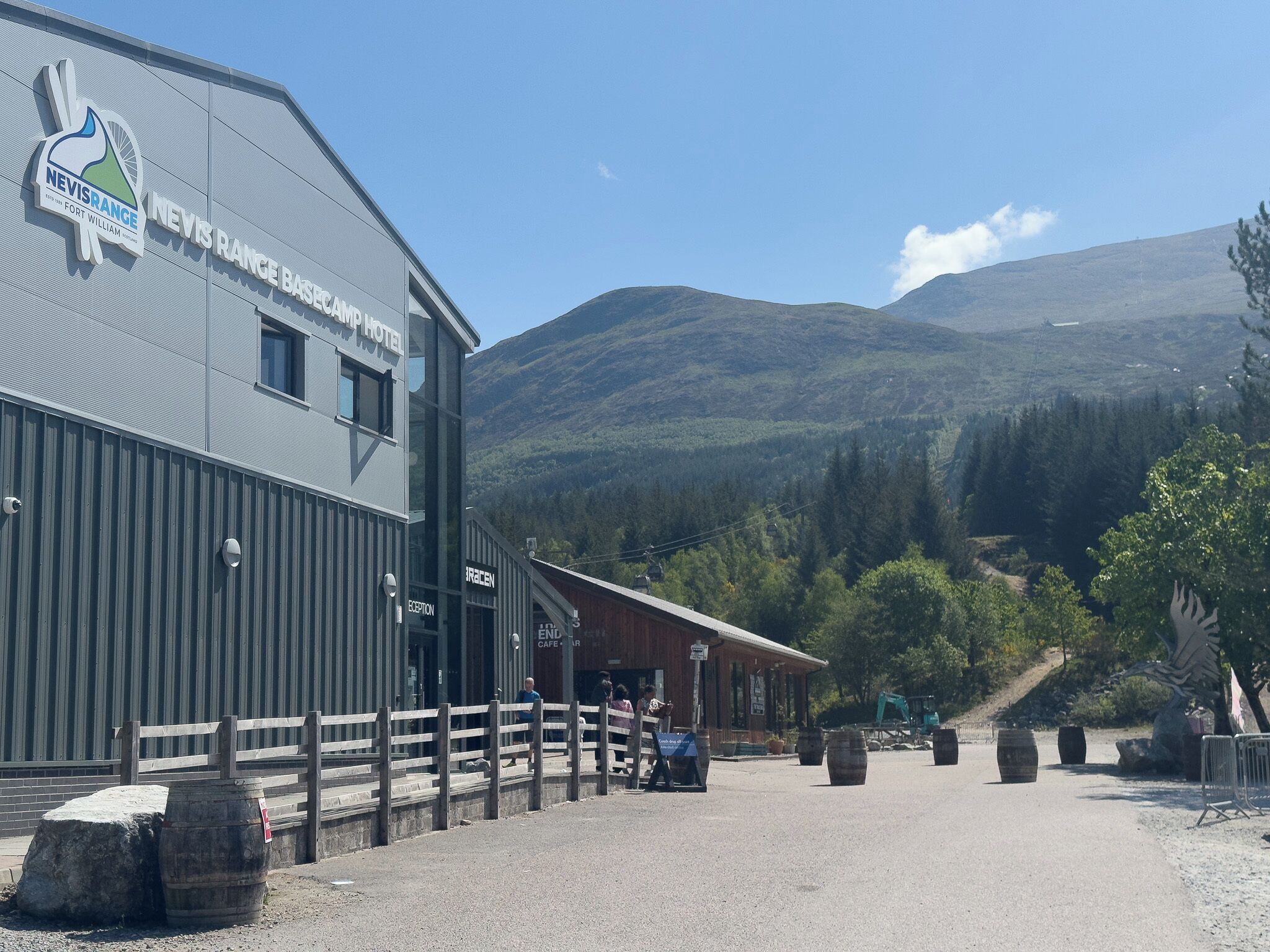 A hotel named Nevis Range with a mountain backdrop.
