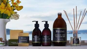 Shower, designer toiletries, hair dryer, towels