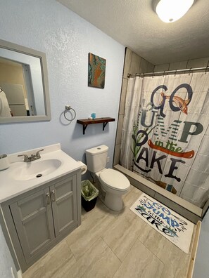 Shower, hair dryer, towels, soap
