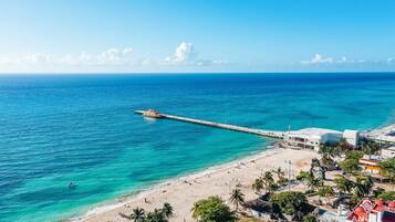 On the beach, sun loungers, beach towels