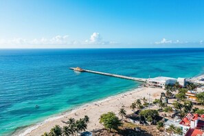 On the beach, sun loungers, beach towels