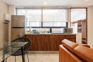 Fridge, microwave, stovetop, coffee/tea maker