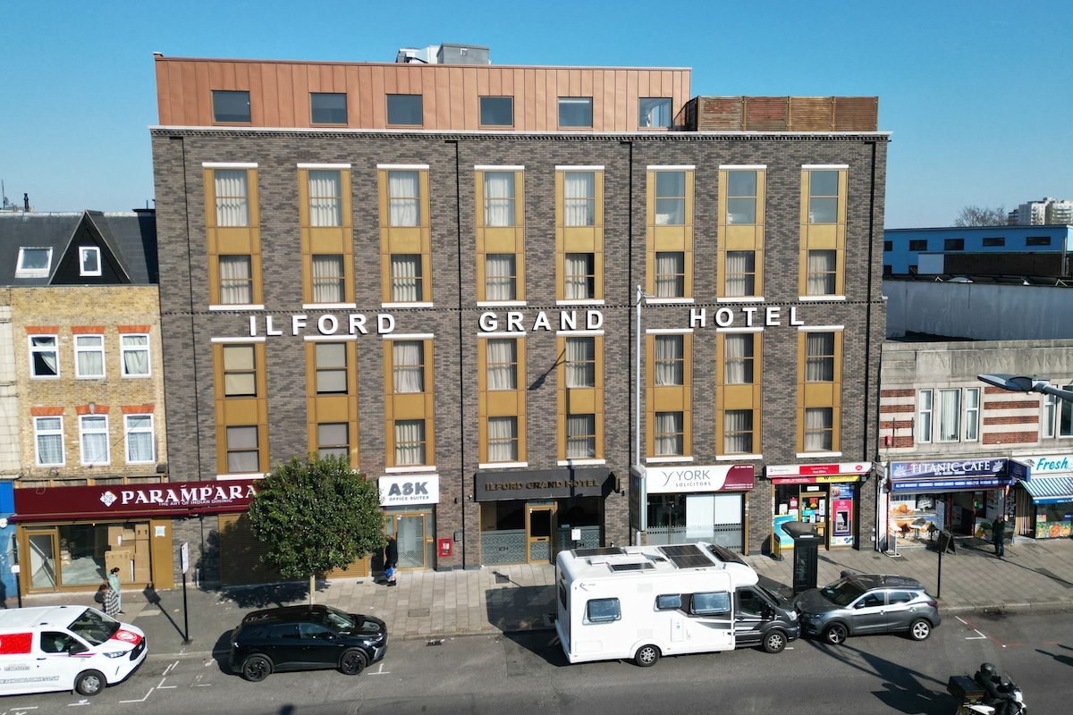 A multi-story building with the sign 'ILFORD GRAND HOTEL' indicating a hotel.