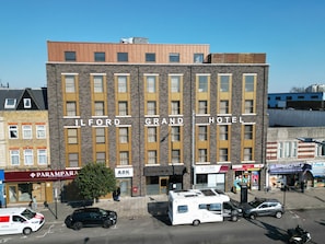 A multi-story building with the sign 'ILFORD GRAND HOTEL' indicating a hotel. - ILFORD GRAND HOTEL (Fully Air Conditioned) (Ilford)