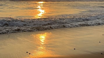 On the beach, sun-loungers, beach towels