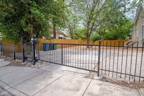 Set amidst a shaded yard with a fence, this home offers a peaceful retreat.