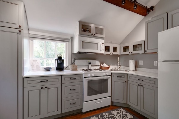 Fully equipped kitchen with everything you might need for meal preparation.