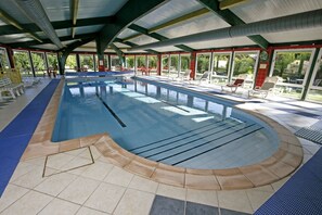 Indoor pool, pool umbrellas, sun loungers