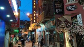 A street view with a hotel named "İpek Otel" prominently displayed. - İpek Otel (Balikesir)