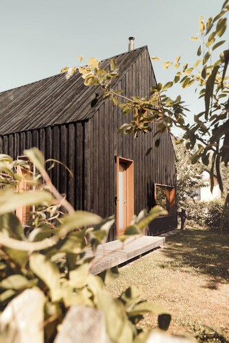 Modern wooden house on the Bodden with two apartments that can be combined