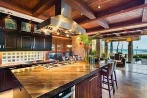 Enjoy a meal in the kitchen with an oven and island, then relax by the stone fireplace.