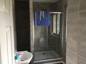 Shower, hair dryer, towels, soap