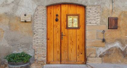 Room with private bathroom and living room in a rural house