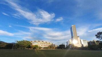 A stadium with a tall tower in the background.