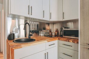 Fridge, microwave, stovetop, coffee/tea maker