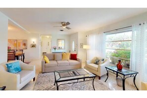 Relax in this inviting living room with a sofa, armchair, and coffee table.