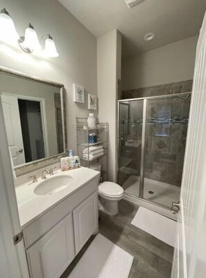 Shower, hair dryer, towels, toilet paper