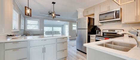 Fridge, microwave, stovetop, coffee/tea maker