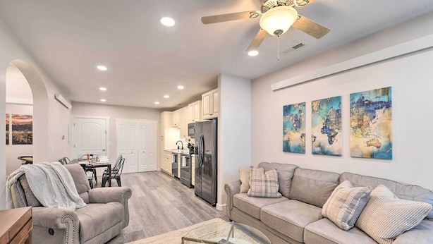A spacious living room with a sofa, a glass coffee table, and a ceiling fan. - Cozy Home: Mtn Views, A/C, in Heart of Star Valley (Etna)