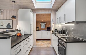 Fridge, stovetop, dishwasher, coffee/tea maker