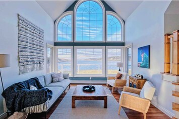 Enjoy vast lake views in the living room off of the kitchen