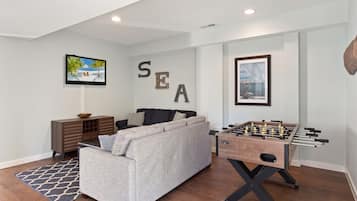 Flat-screen TV, fireplace, foosball