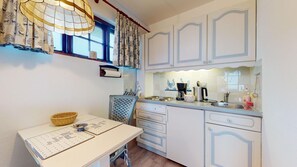 Fridge, electric kettle, cookware/dishes/utensils