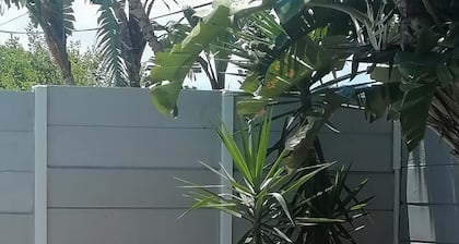 Cozy cottage for family getaway with private patio and pool in safe suburb.