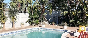 Cozy cottage for family getaway with private patio and pool in safe suburb.