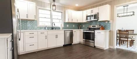 Fridge, coffee/tea maker, cookware/dishes/utensils