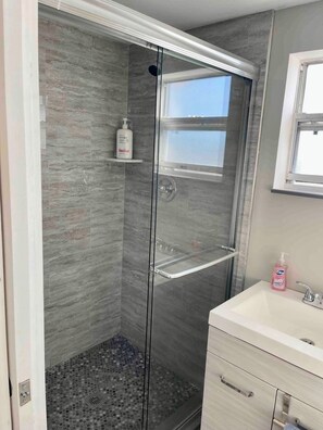 Shower, hair dryer, towels, soap