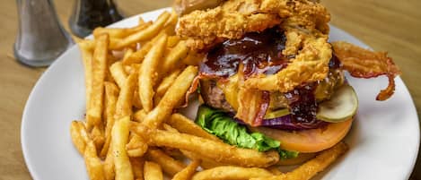 A plate with a sandwich and fries.