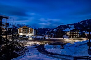 A hotel with a modern design, featuring multiple floors and a prominent entrance. - Appartement Rocailles 7 - La Tzoumaz, 4 Vallees (La Tzoumaz)