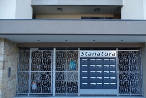 A building facade with a sign reading "Stanatura". - Apartment for 4/6 people, 10 minutes from the beach... (Porto-Vecchio)