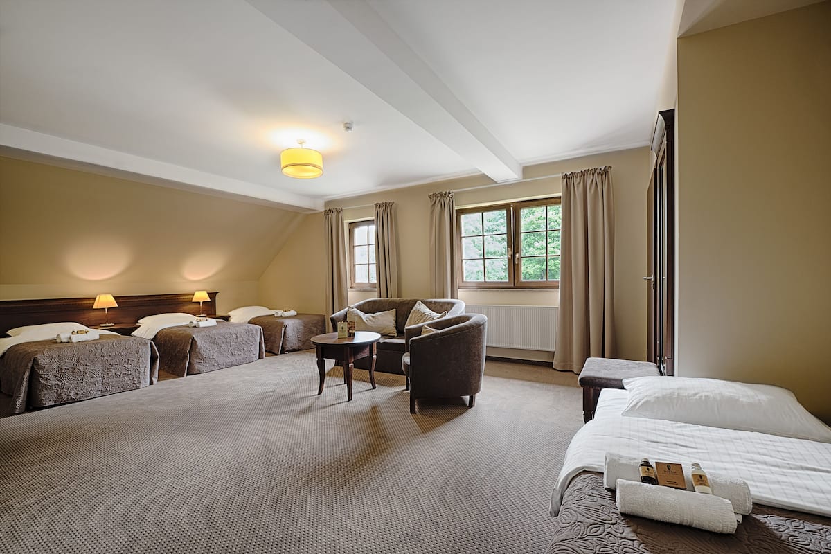 Superior Quadruple Room | In-room safe, desk, blackout drapes, iron/ironing board