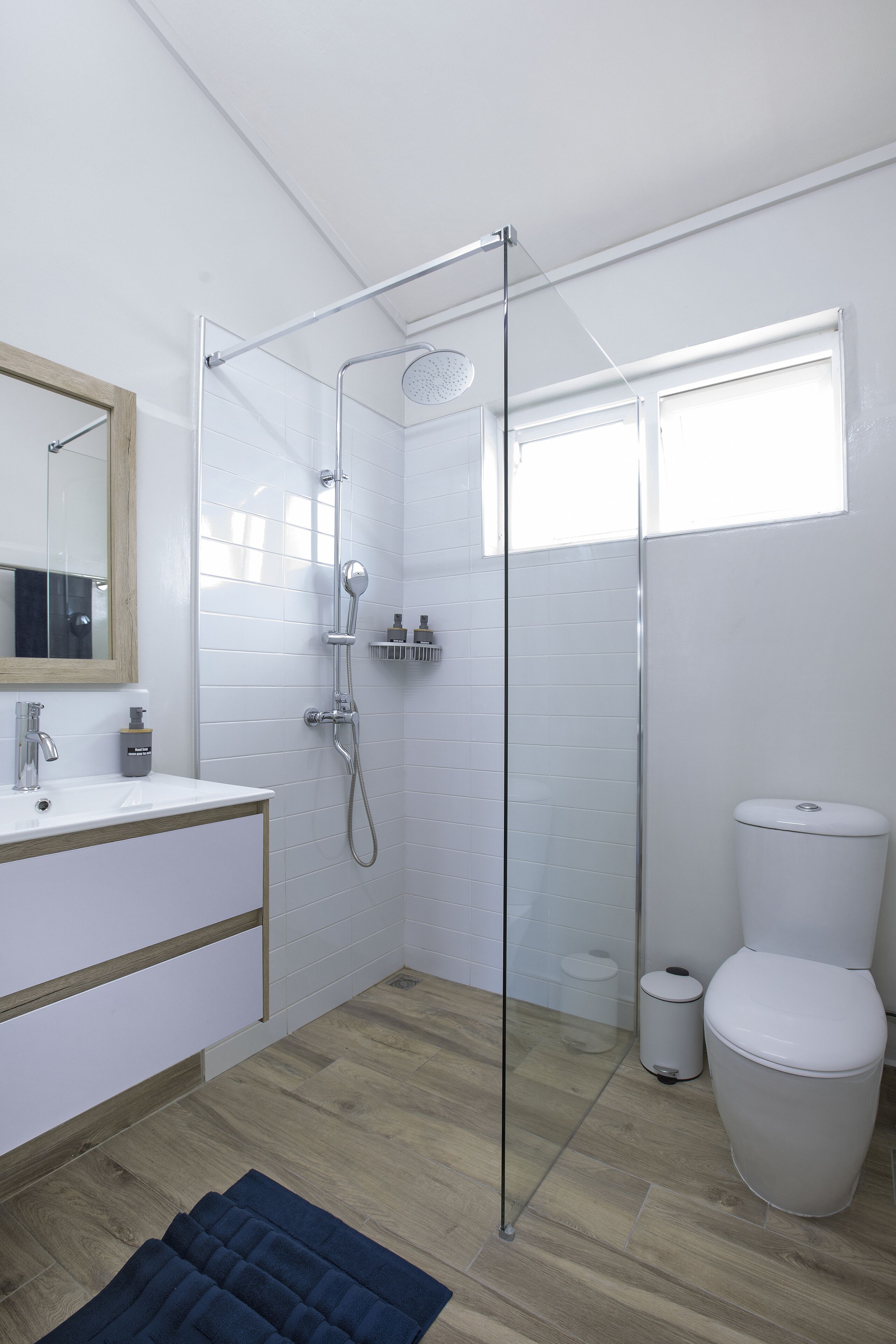 Shower, hair dryer, towels, shampoo