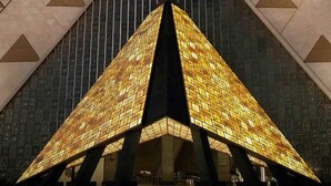 A pyramid-shaped building with a tiled facade and a dark interior. - New Midtown Hotel (Cairo)