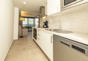 Comfort Apartment | Private kitchen | Full-size fridge, microwave, oven, stovetop