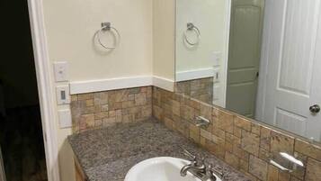 Bathtub, hair dryer, towels