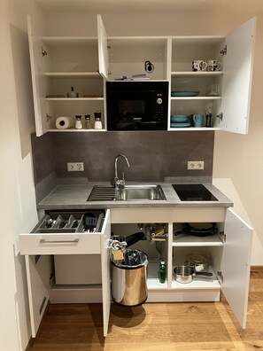 Fridge, microwave, stovetop, coffee/tea maker